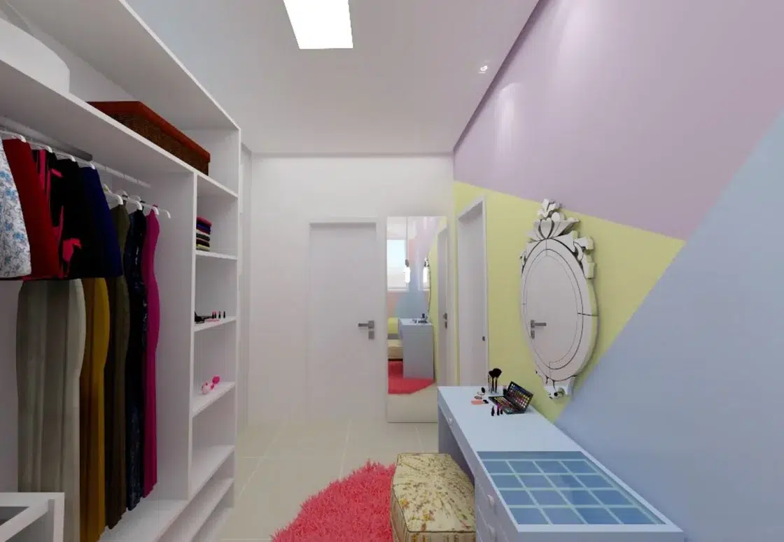 Closet de menina com cores de unicórnio com iluminação tanto artificial, quanto natural, com penteadeira e um puff
