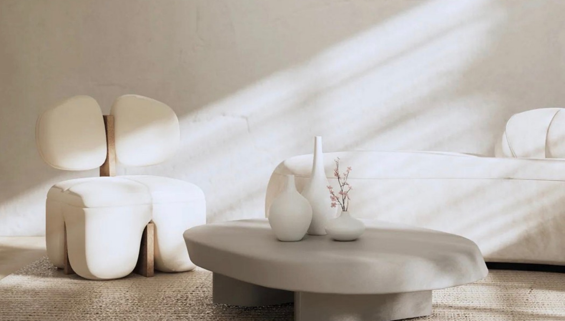 poltrona e sofá branco e mesa de centro de forma orgânica na cor cinza