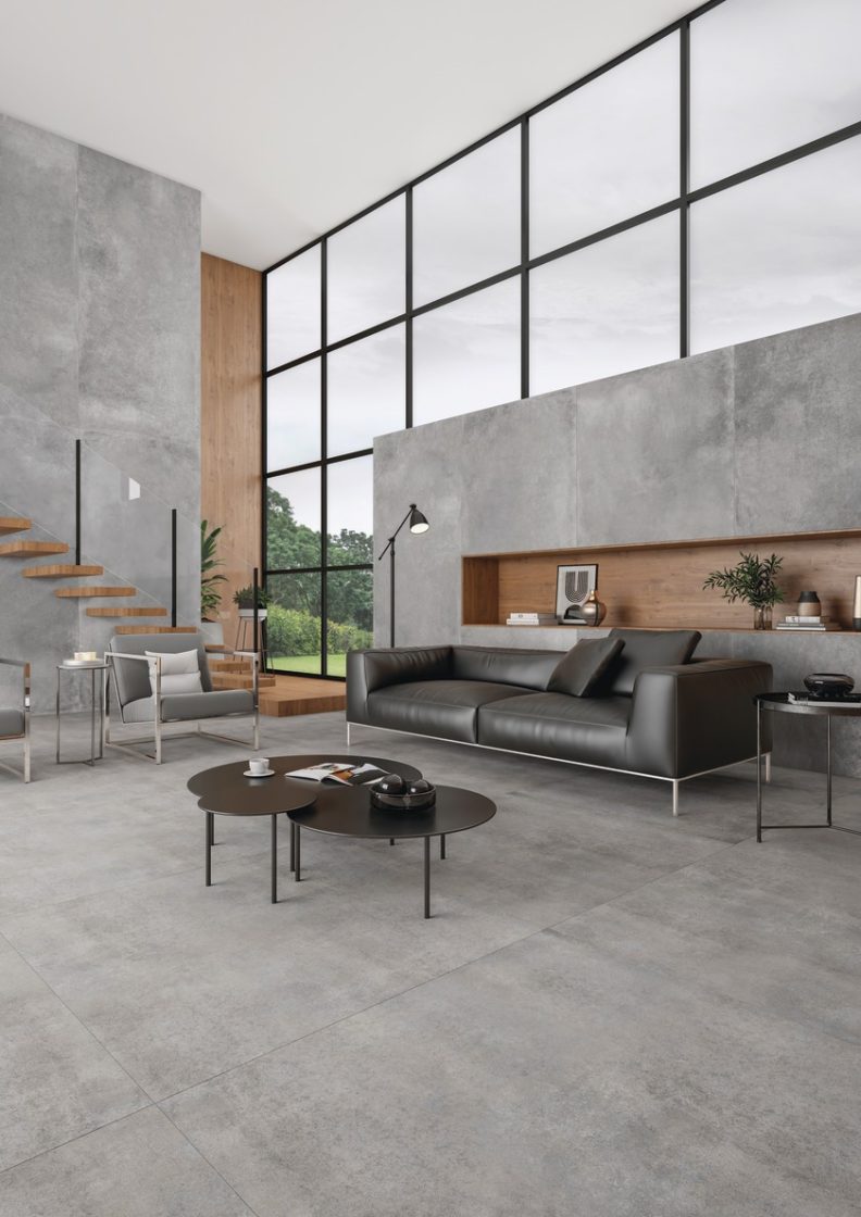 Sala de estar em estilo moderno com piso com revestimento que reproduz cimento queimado