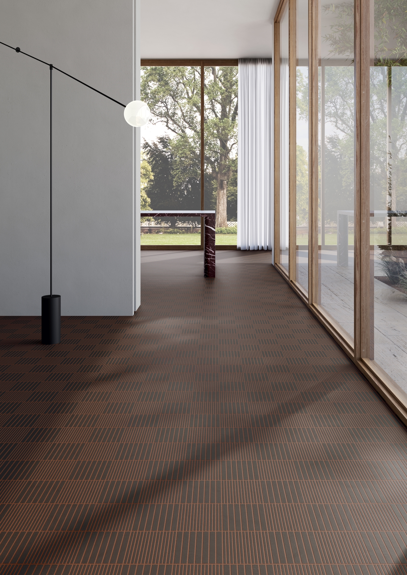 Ambiente com revestimento fringe na cor Anthracite e grandes aberturas de vidro, com muita luz natural
