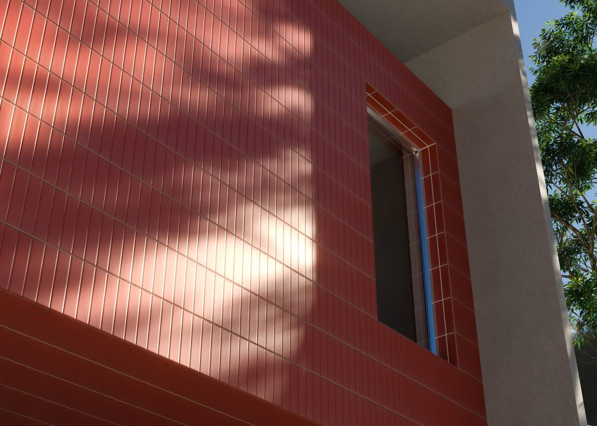 Construção moderna com uma fachada que combina materiais distintos, com ênfase no revestimento vermelho