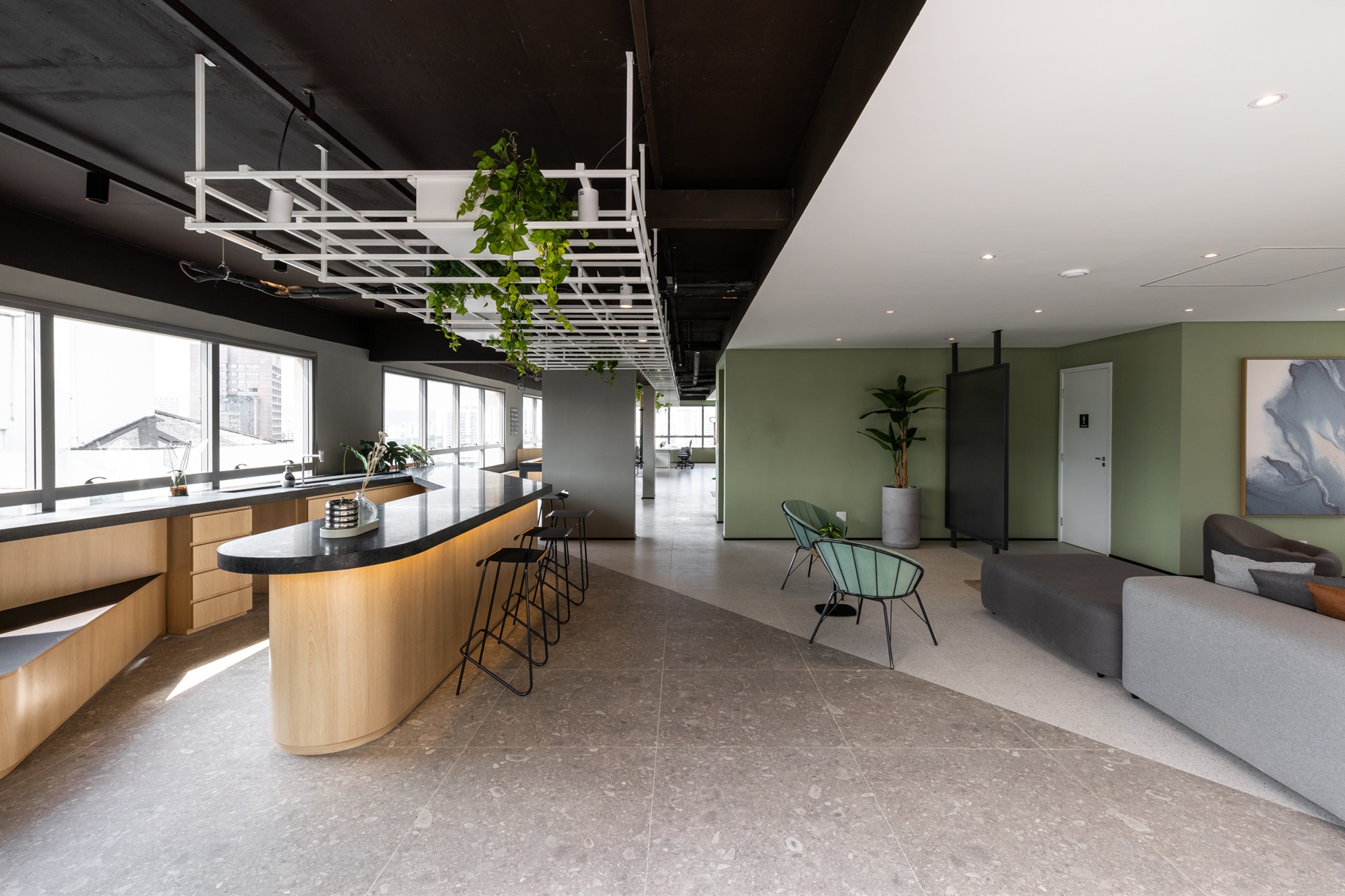 coliving Ambiente de coliving integrado com cozinha compartilhada, bancada iluminada e áreas de convivência aconchegantes, unindo funcionalidade, design contemporâneo e toques de natureza