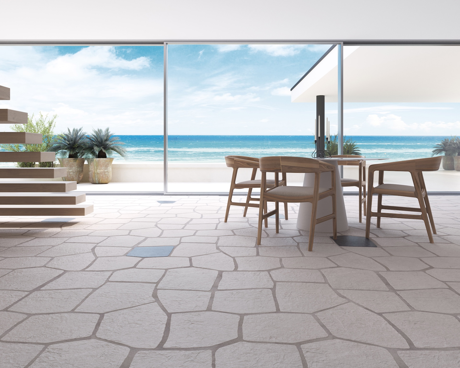 Área externa com vista para o mar e piso Kit Janeiro Off White com detalhes Black